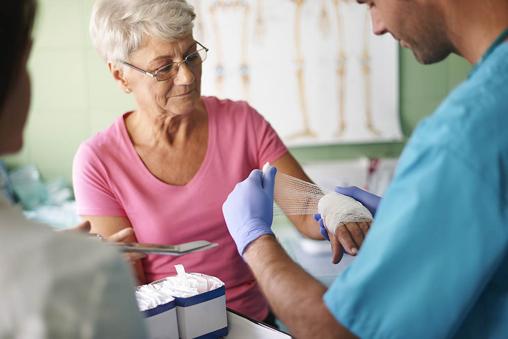 Doctor Wrapping Patient